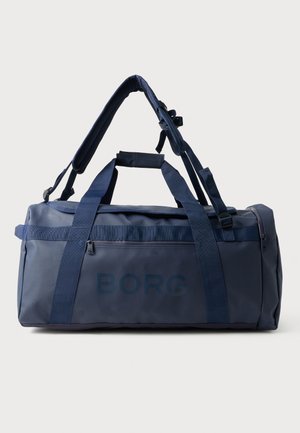 Jūras kara flotes zila sporta soma, kas izgatavota no izturīga auduma, ar divām rokturiem, regulējamu plecu siksnu un ar rāvējslēdzēju aizveramu kabatu vienā pusē.