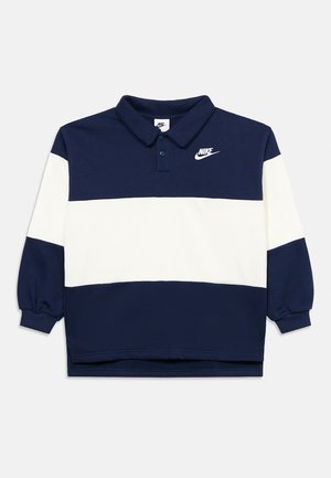 Marineblå og hvit fargedelt langermet poloskjorte med krage, Nike-logo på venstre bryst og ribbede mansjetter.