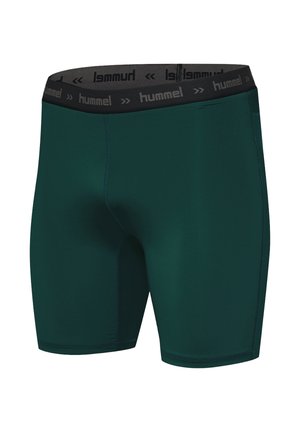 Kompressionsshorts aus dunkelgrünem Stoff, mit einem schwarzen elastischen Bund und "hummel"-Branding, glatter Textur und enganliegendem Schnitt.