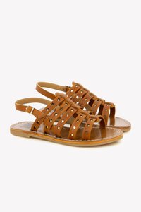 Brown leather sandals with star-shaped metal accents, open-toe design, multiple crisscross straps, and adjustable ankle straps.