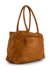 Sac cabas en cuir marron avec deux poignées, comportant une poche zippée sur le côté et une base arrondie. Texture lisse avec des détails de couture minimaux.