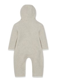Body in pile beige con cappuccio, maniche lunghe e design senza piedi. Tessuto morbido con una costruzione semplice e senza cuciture.