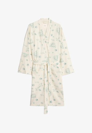 Bata crema con un patrón texturizado de rayas, que presenta impresiones azules de conchas, soles y pájaros. Tiene mangas largas y un cinturón a juego.