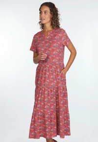 Kleid mit Blumenmuster in Rosa- und Rottönen, mit kurzen Ärmeln, einem V-Ausschnitt und einem gestuften Rock. Verfügt über seitliche Taschen und einen leichten Stoff.