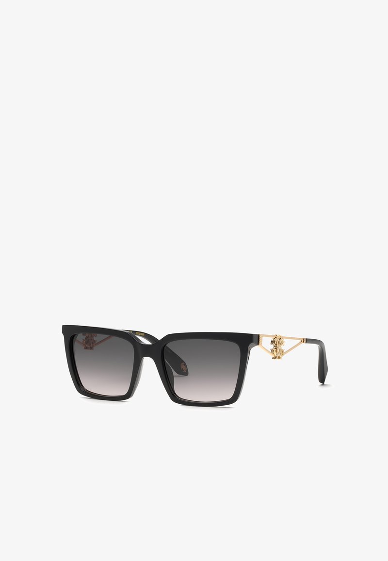 Lunettes de soleil carrées noires avec verres dégradés et détail décoratif doré sur les branches.