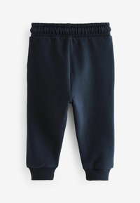 Navyblaue Jogginghose aus weichem Stoff, mit elastischem Bund und gerippten Knöchelbündchen für eine enge Passform. Einfaches Design ohne Muster.