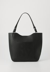 Black leather tote bag with a textured surface, featuring a perforated DKNY logo in the center and two shoulder straps for carrying.