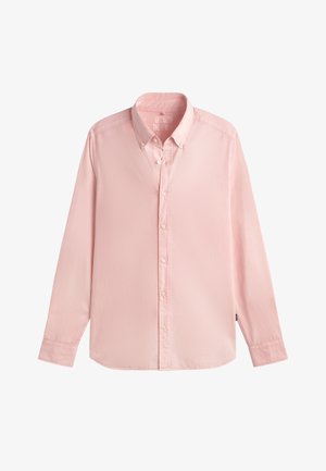 Light pink long-sleeve button-up shirt with a pointed collar, visible stitching, and small brand tag on the left side seam.