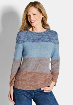 Maglione a maglia con strisce orizzontali in tonalità di blu e marrone. Collo rotondo e maniche lunghe con una vestibilità comoda. Texture morbida.