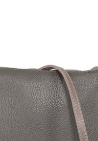Gray leather handbag with a textured surface, featuring a smooth shoulder strap and a zip closure along the top edge.