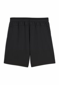 Shorts de sport noirs en tissu lisse et léger. Dotés d'une taille élastique, de deux poches latérales et d'une coupe au niveau des genoux.