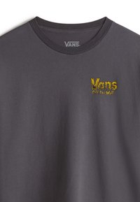 Dark gray cotton t-shirt with short sleeves, featuring a yellow embroidered "Vans Off the Wall" logo on the chest. Round neckline.
