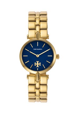 Goldene Metallarmbanduhr mit blauem Zifferblatt, goldenen Zeigern und Stundenmarkierungen, Tory Burch-Logo bei 6 Uhr und Markennamen unter 12 Uhr.