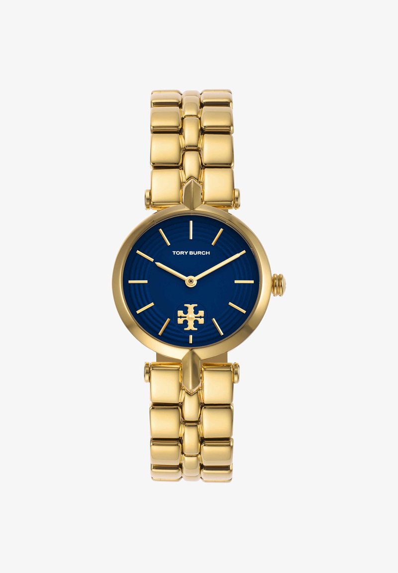 Orologio bracciale in metallo dorato con quadrante blu, lancette e indici dorati, logo Tory Burch alle 6 e nome del marchio sotto le 12.