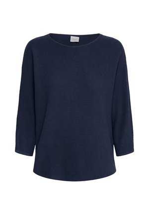 Laivastonsininen neuletakki, jossa on väljä istuvuus, leveä pyöreä pääntie ja kolmen neljänneksen hihat. Kaksikerroksinen ribbineulospinta suoralla helmalla.