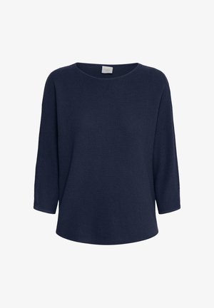 Laivastonsininen neuletakki, jossa on väljä istuvuus, leveä pyöreä pääntie ja kolmen neljänneksen hihat. Kaksikerroksinen ribbineulospinta suoralla helmalla.