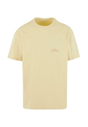 T-Shirt mit kurzen Ärmeln und Rundhalsausschnitt in hellgelbem Baumwollstoff, mit einem kleinen, dezenten Logo in einem helleren Farbton auf der Brust.
