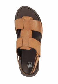 Brown leather sandal featuring wide cross straps, cushioned footbed, and a dark rubber sole, designed for comfort and support.