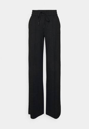 Pantaloni neri a gamba larga realizzati in tessuto morbido. Presentano un elastico in vita con cordoncino, linee pulite e nessun motivo o accessorio visibile.