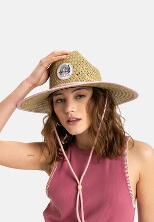 Straw sun hat with wide brim, light brown color, pink accents, adjustable chin strap, and a circular logo patch on the front.