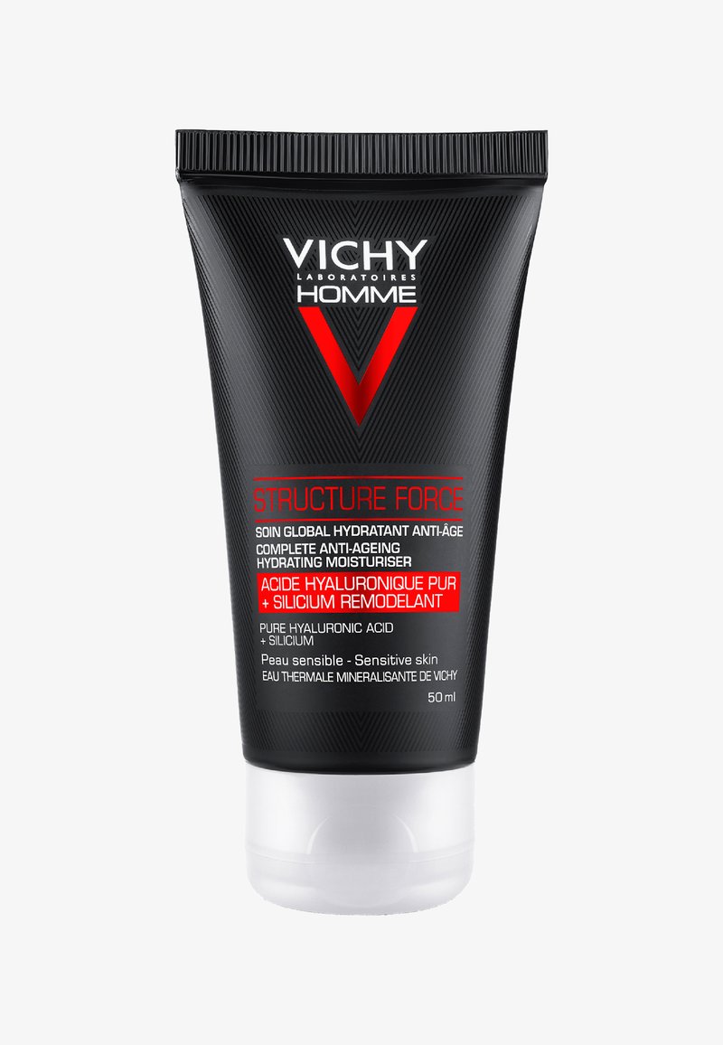 Black tube with a matte finish. Features a red logo and white text; labeled "Structure Force" and "Complete Anti-Ageing Moisturiser." 50 ml.