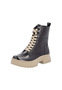 Bottines en cuir noir avec des lacets beiges et une semelle épaisse beige, dotées d'une languette et d'œillets ronds décoratifs. Texture lisse.
