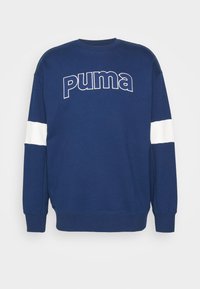 Navy blue sweatshirt with white stripes on the sleeves, featuring a large white "puma" logo across the chest. Soft fabric, relaxed fit.