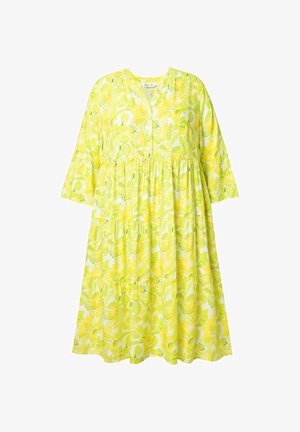 Kukikkaalla kuviolla varustettu mekko kirkkaankeltaisessa värissä, kevyt kangas. Mekossa on löysä istuvuus, puolipitkät hihat ja laskostettu helma.