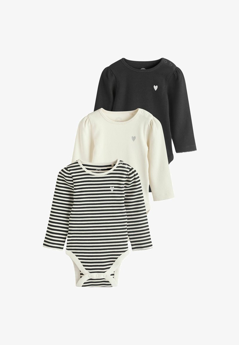 Kolm pikakätist beebiriietust: must puuvillane topp, kreemjas ribaga topp, millel on süda, ja must-valge triibuline body, millel on näpitsad.