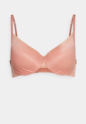 Sutien roz cu o textură netedă, prezentând un model subtile embossat, bretele ajustabile și o formă clasică a cupei. Include închidere pe spate.