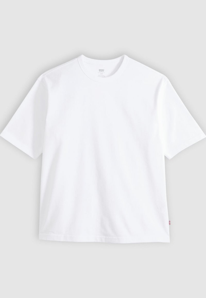 T-shirt blanc à manches courtes en coton, doté d'un col rond et d'une coupe droite. Étiquette visible sur l'ourlet latéral inférieur.