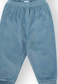 Pantalones azules de mezcla de algodón con cintura elástica, diseño de pierna cónica y textura suave. Estilo minimalista sin patrones visibles.