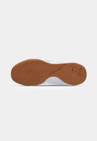 Brown rubber outsole with intricate tread pattern, featuring a white midsole and black accents. Smooth texture with a rounded shape.
