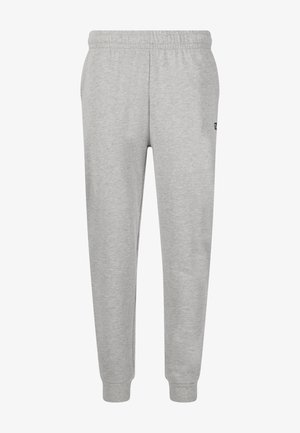 Lysegrå joggingbukser med elastisk talje og manchetter, sidelommer og en lille sort logo på højre lår.