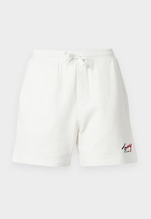 Hvite bomullsshorts med elastisk midjebånd, snor, sidelommer og en liten rød og svart Tommy Jeans-logo på venstre ben.