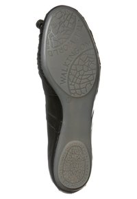 Svart lädersula med strukturerat greppmönster. Har präglat varumärke "WALKING ON" och storlek "37" nära hälen. Slät yta.