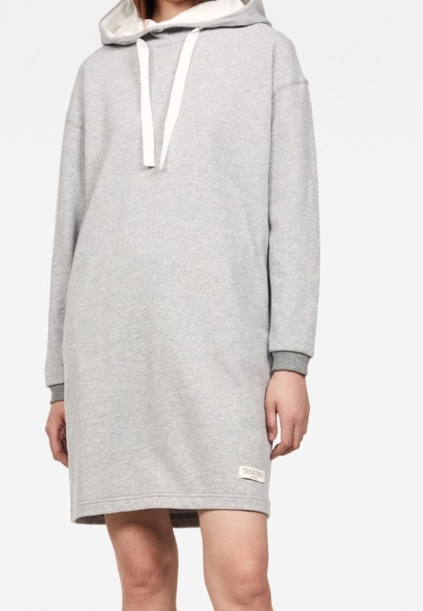 Grå huvtröja klänning med en kenguruficka, vita dragsko och ribbade ärmslut. Slät textur med en avslappnad, lös passform.