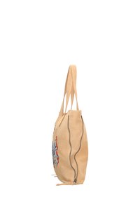 Borsa tote in pelle beige con un design floreale, dotata di zip lungo i fianchi e doppi manici per il trasporto.