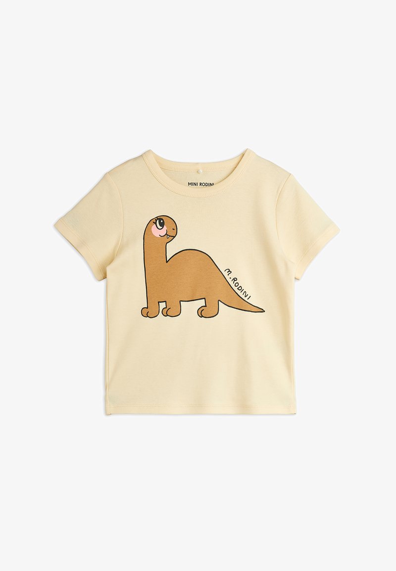 Svetložlté bavlnené tričko s potlačou hnedého kresleného dinosaura, krátke rukávy, okrúhly výstrih a jemná textúra.