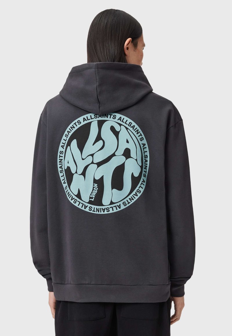 Felpa con cappuccio grigio scuro con una grande grafica circolare verde menta e testo stilizzato sul retro. Tessuto morbido con cappuccio regolabile tramite coulisse.