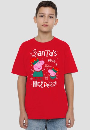 Red cotton t-shirt featuring a colorful print of two cartoon pigs in elf attire, with text "Santa's little Helpers!" and festive accents.