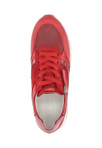 Red sneaker featuring mesh panels, metallic accents, and a zip closure. The design includes rounded toe and textured laces.