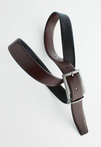 Leather belt featuring a reversible design with dark brown and black sides, silver-tone buckle, and multiple notches for adjustment.