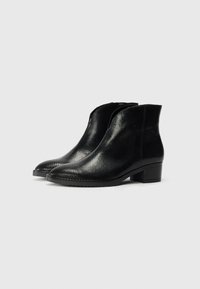 Black ankle boots with a textured, reptile-inspired finish, a slightly pointed toe, and a low block heel. Simple design with no visible hardware.