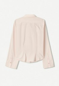 Pale pink long-sleeve shirt with a collar, featuring buttoned cuffs, a rounded hem, and back pleats for added detail.