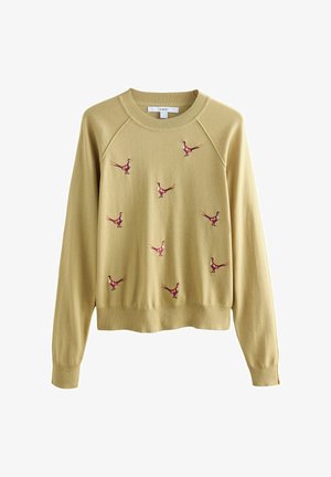 Heled kollane tõmmatud ketrus, millel on raglanvarrukad, esitades tikitud punaseid ja roosasid faasane, mis on laiali jaotatud esiküljel. Pehme kootud kangas.