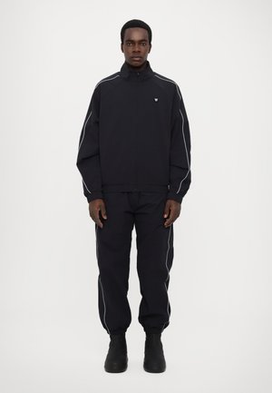 ADE CRINKLE TRACK UNISEX - Træningsjakke - shadow side
