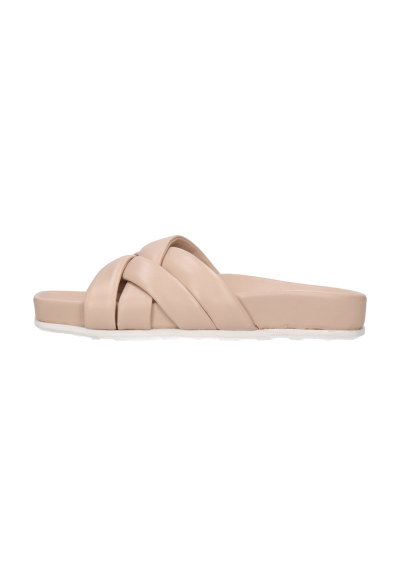 Beige slide sandals with a smooth, matte texture, featuring multiple crisscross straps and a flat, cushioned sole.