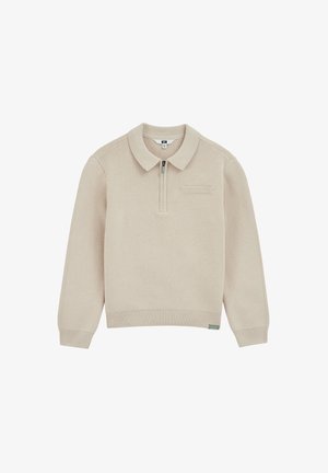 Beige gebreide trui met een kraag en een halve ritssluiting aan de voorkant. Heeft lange mouwen, geribde manchetten en een klein opgestikt zakje op de borst.