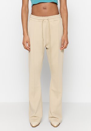 Träningsbyxor - almond
